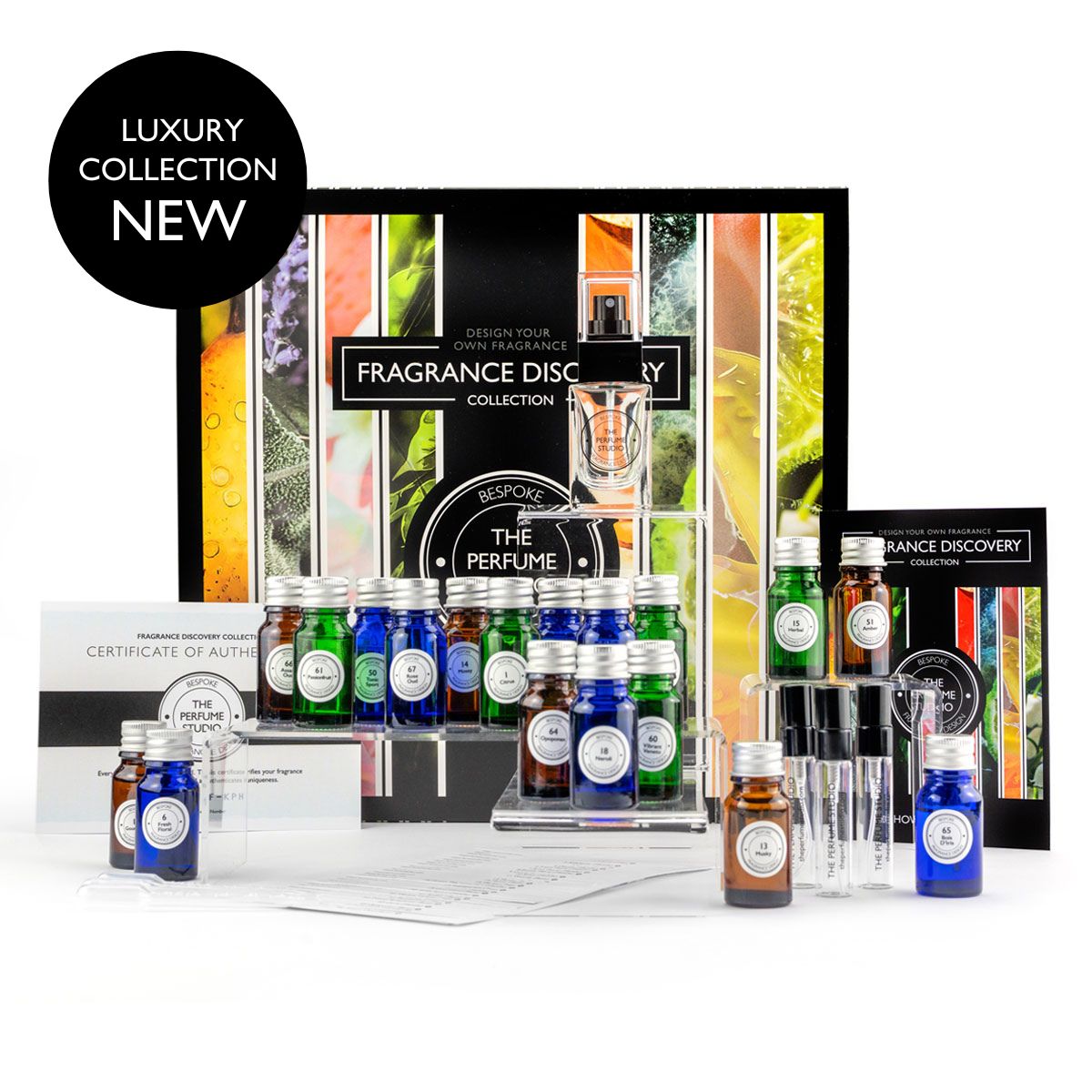 Luxury fragrance discovery collection with various bottles and packaging on a white background.