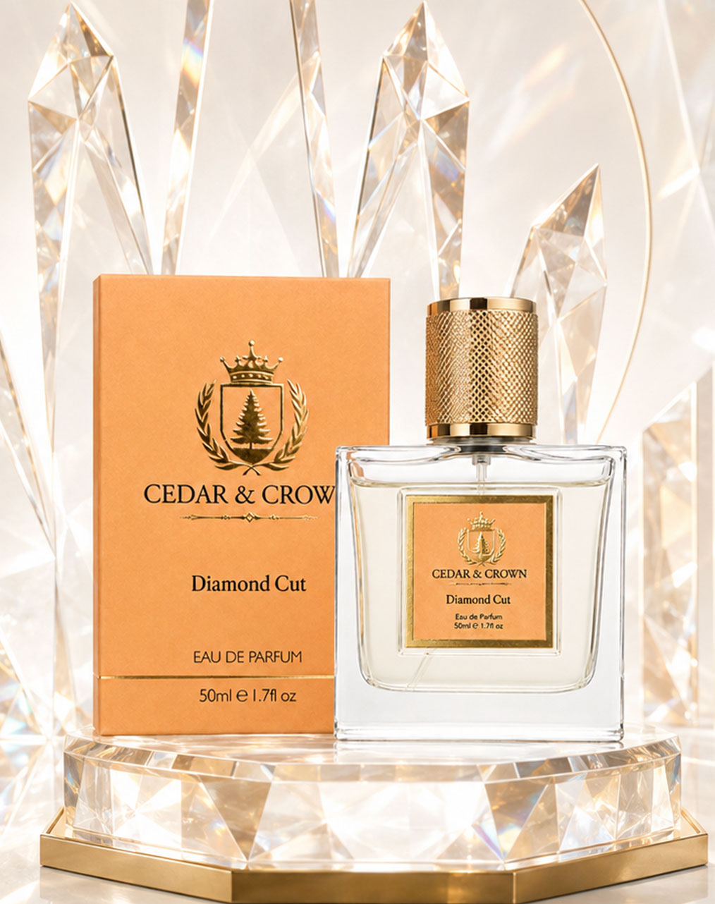 A bottle of Cedar & Crown Diamond Cut Eau de Parfum next to its peach-colored box, displayed on a gold and crystal pedestal.